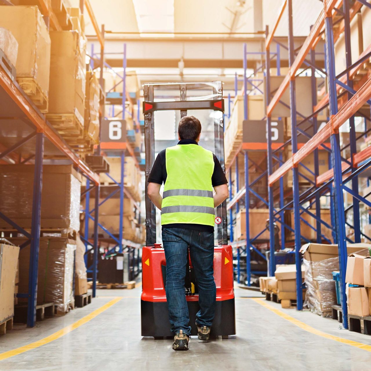 Man with forklift in warehouse image