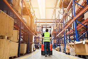 Man with forklift in warehouse image