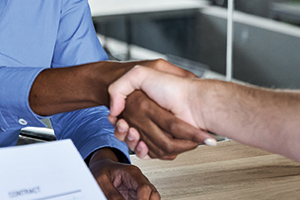 two people shaking hands